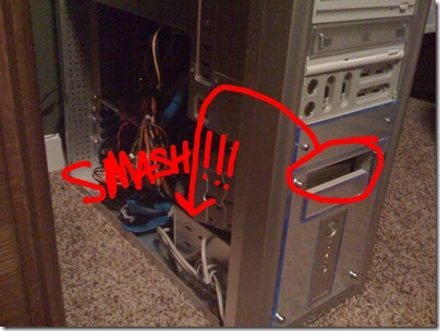 Photo of the open side of my Computer Case with the Floppy casing falling on my hard drive with arrows and the word SMASH in red.